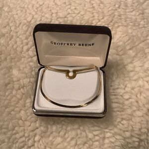 Geoffrey Beene Gold-Tone Men's Button Tie chain.